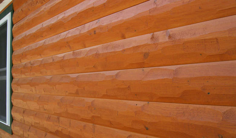 HEWN textured log siding home